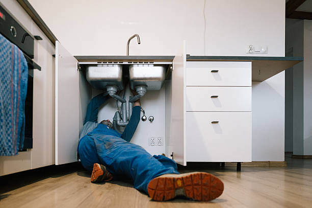 Professional Emergency Plumber technician working in Versailles, IN